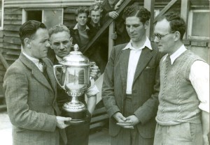 Len Comley receives the Combination Cup (won by the reserves). Brought in by his son Jeffery